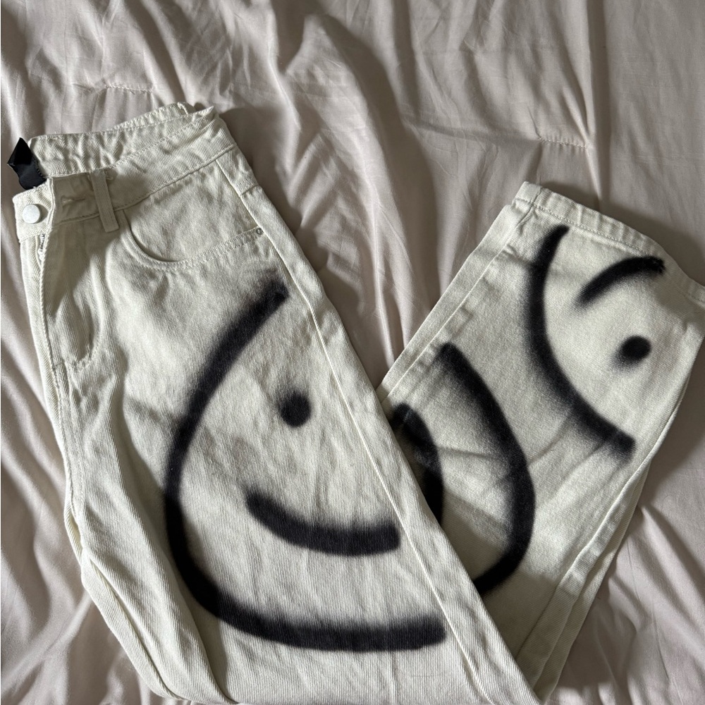 White Jeans with Black Smiley Design
